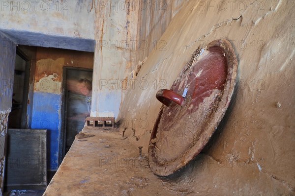 Lid of cooking pot on mantelpiece