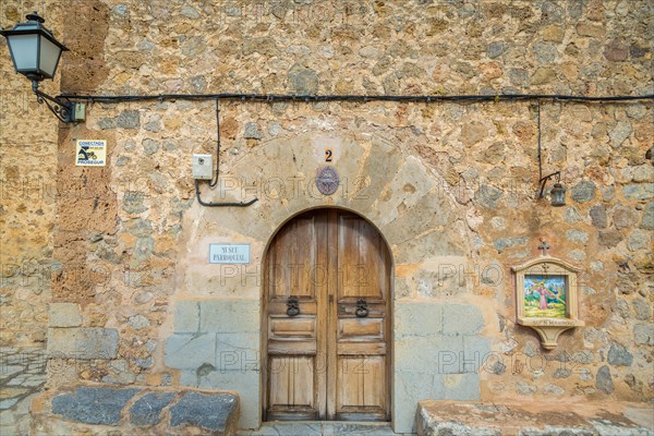 Wooden door with station Stations of the Cross