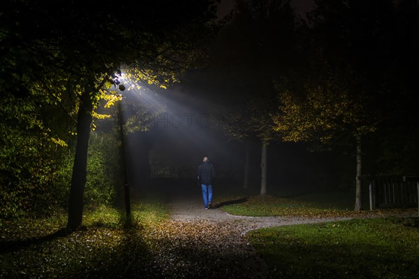 A man walks through a lonely park in Markt Swabia