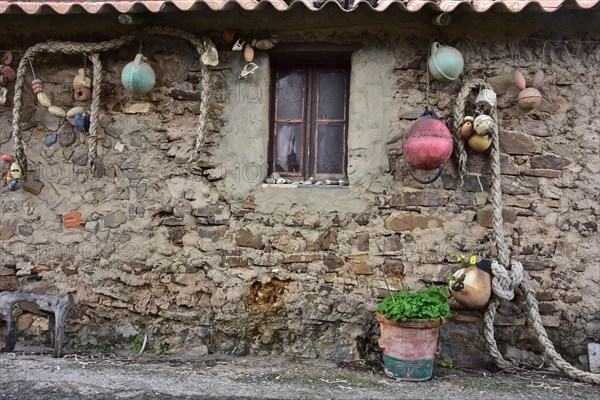 Ropes and buoys as decoration on the wall of a fishing house