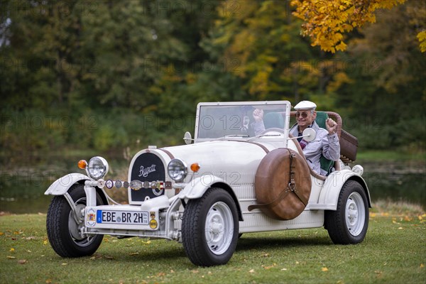 An elderly gentleman sitting in his replica of a 1923 Bugatti 35 B