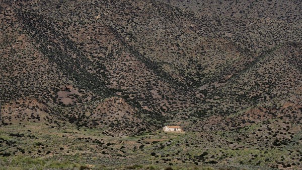 Lonely small finca surrounded by hills