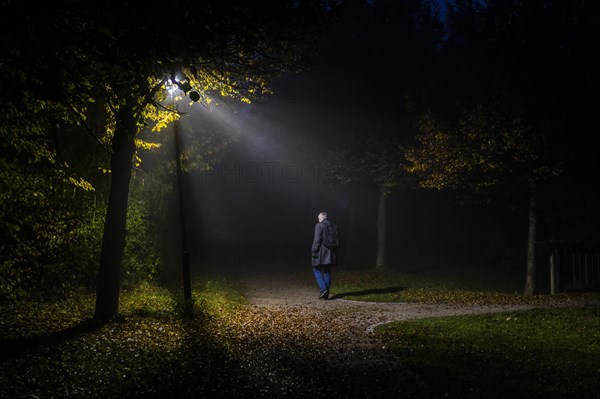 A man walks through a lonely park in Markt Swabia