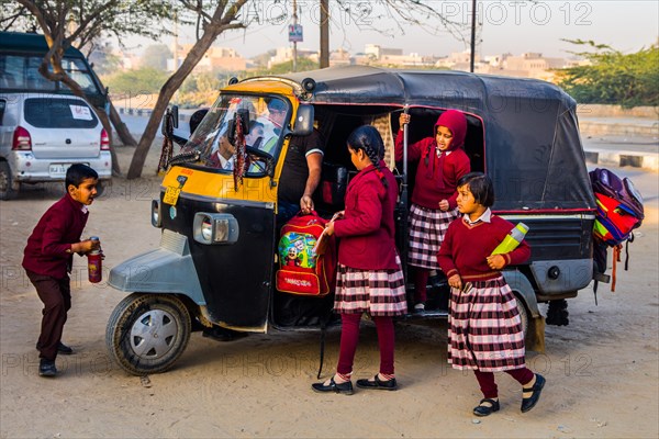 Students getting out of the tuk-tuk