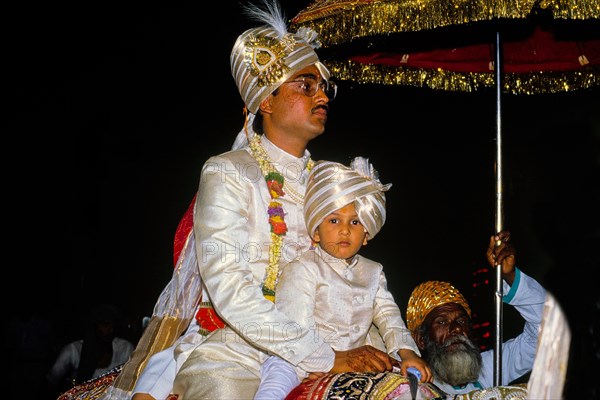 Groom comes riding on a white horse