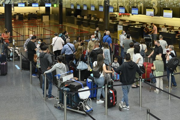 Passengers checking in at Zurich Airport