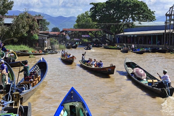 Boats in the main channel of Intha Pile Village Inn Paw Khon