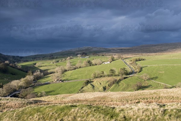 Storm clouds gathering over farmland near Ravenstonedale