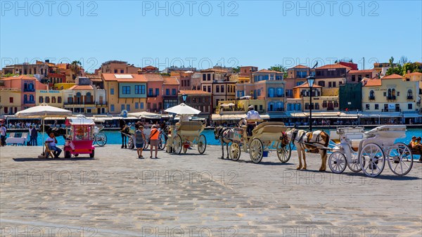 Panorama harbour town of Chania with tourist carriages