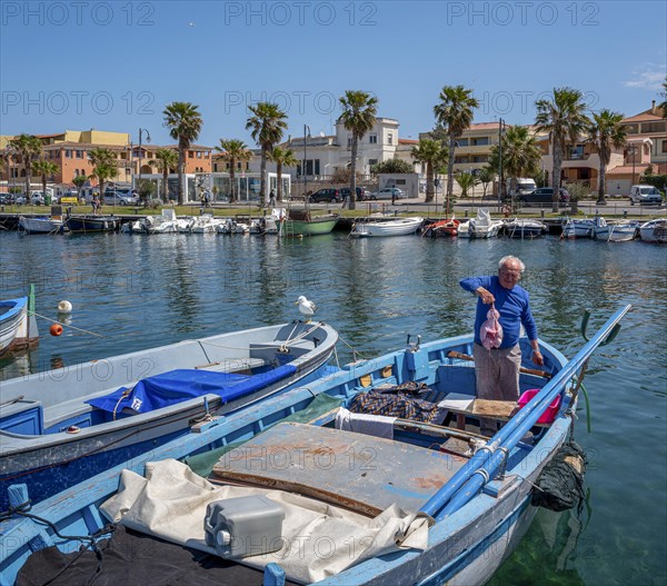 Sardinian fishermen in the harbour of Figari at Golfo Aranci