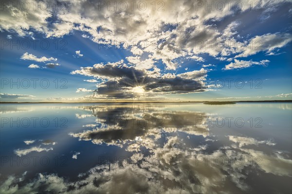 Filso with reflection of the clouds in the morning calm