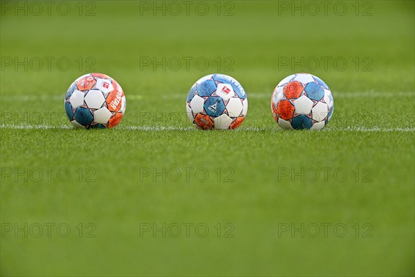 Adidas Derbystar match balls lie on grass