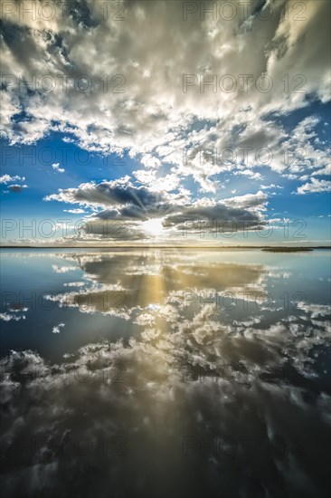 Filso with reflection of the clouds in the calm of the morning