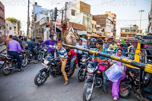 Crowd in front of a railway crossing