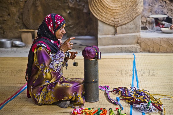 Woman making lace