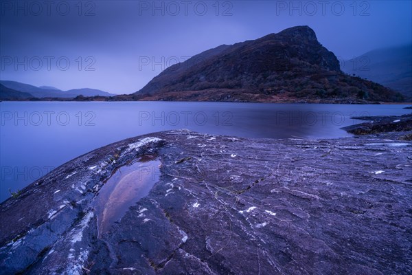 View of mountain in narrow channel connecting lakes