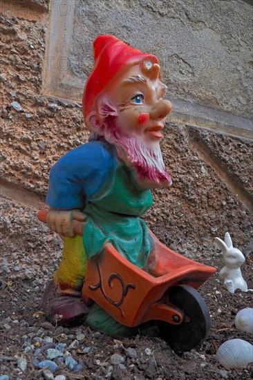 Garden gnome with wheelbarrow