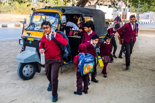 Students getting out of the tuk-tuk