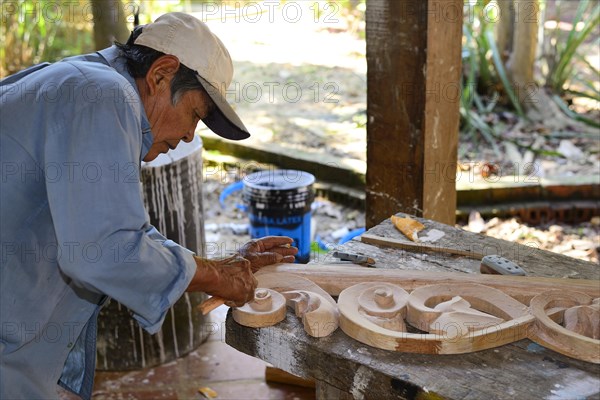 Wood carver at work at the church Iglesia de San Ignacio de Moxos