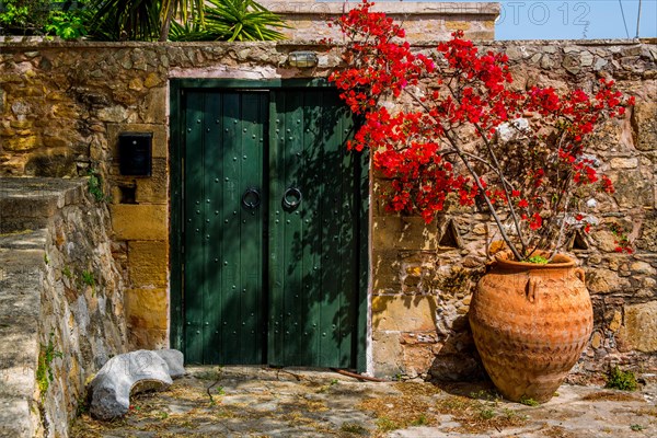 Gate with clay jar at Polyrinia