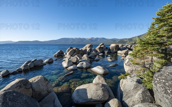 Lake Tahoe shore with round stones in the water