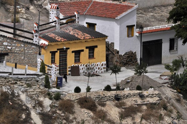 Yellow cave house in village