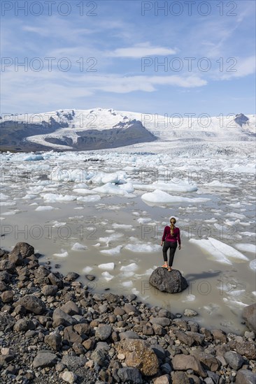 Woman in front of Fjallsarlon ice lagoon