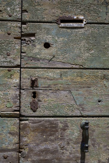 Old wooden door with slot for telegrams