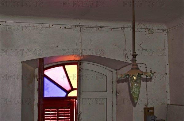 Entrance with lamp in the Art Nouveau style of a former stately finca