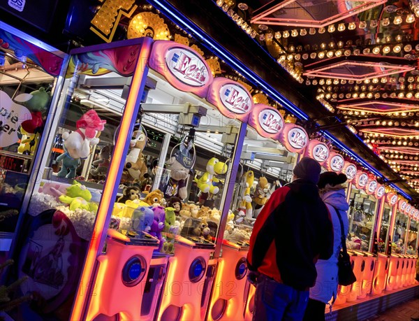 Colourfully illuminated slot machines at a fair