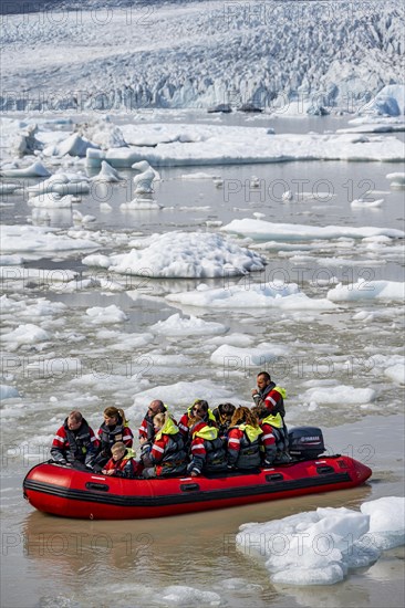 Excursion boat on the ice lagoon Fjallsarlon