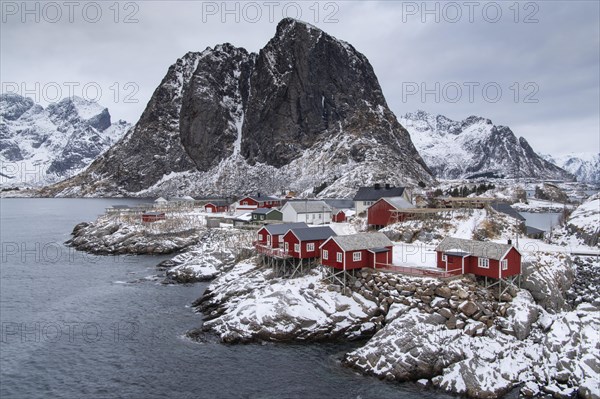 Winter landscape with colourful Scandinavian boathouses