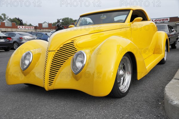 Yellow car at car show