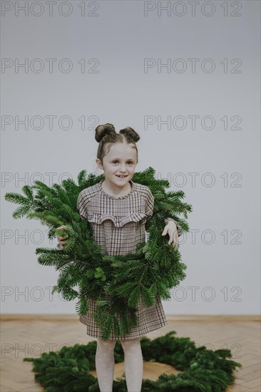 Girl with fir wreath