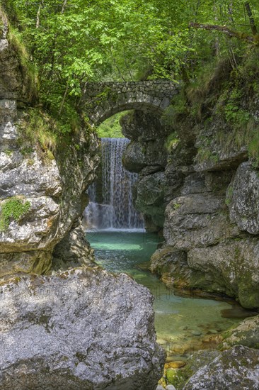 Cascata Rio Repepeit a small artificial waterfall with stone bridge