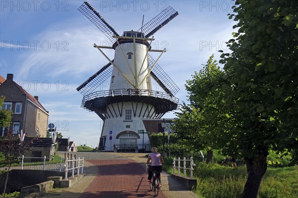 Old mill and cyclist