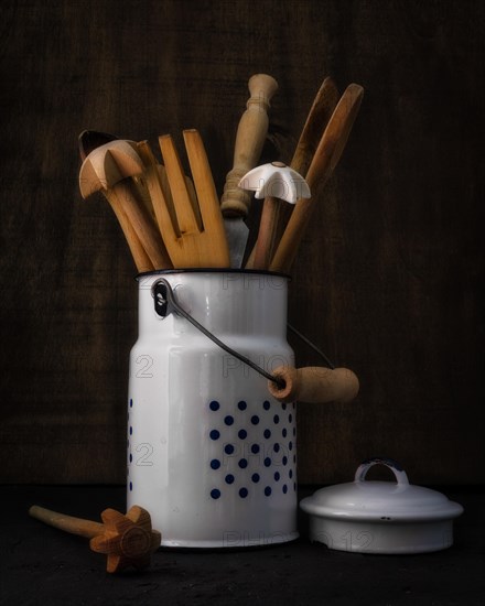 Still Life with Wooden Kitchen Utensils in Old Enamel Milk Can