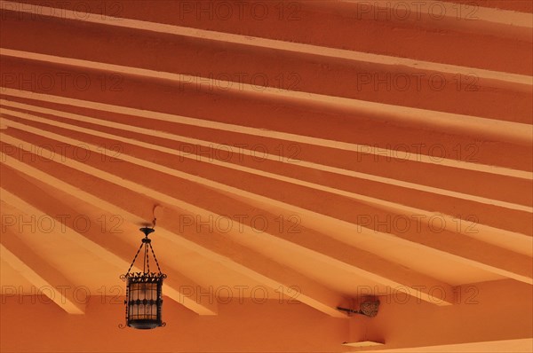 Radiant ceiling with Moroccan lamp and swallow's nest