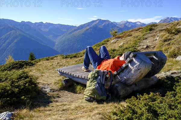 Hiker resting on the Waldburnnenweg