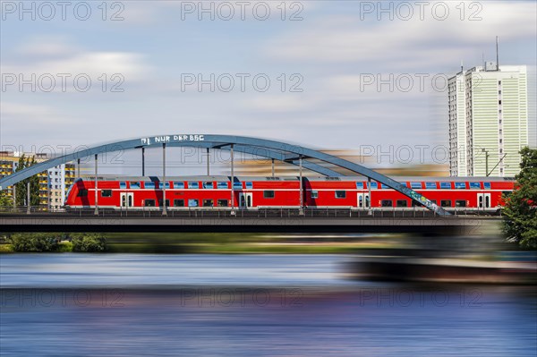 A moving Deutsche Bahn ICE train crosses the railway bridge in Potsdam West