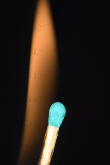 Match head with a flame