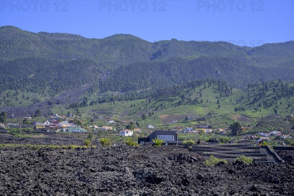 Visitor centre and settlement at the edge of the lava field of the San Juan volcano
