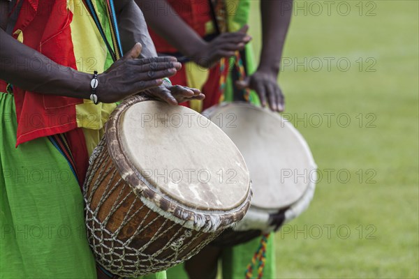 Musicians playing on an African djembe