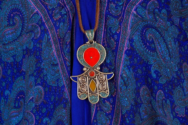 Indian jewellery as pendant on leather strap