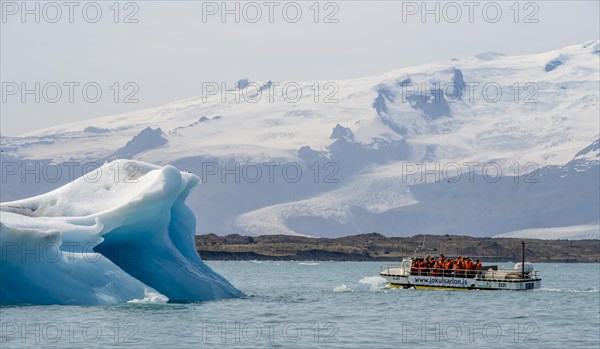 Excursion boat on ice lagoon Joekulsarlon
