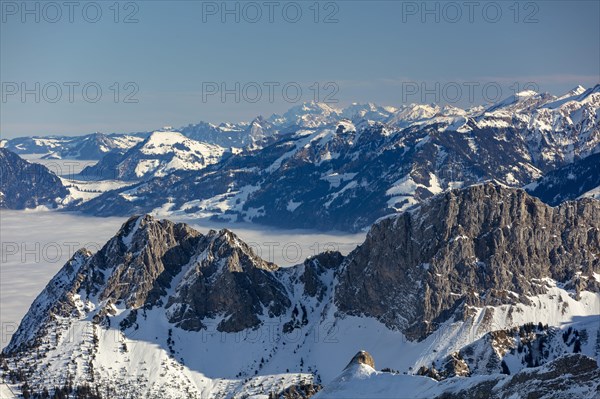 View over the Giswilerstock to the sea of fog and the Central Swiss Alps to the Saentis