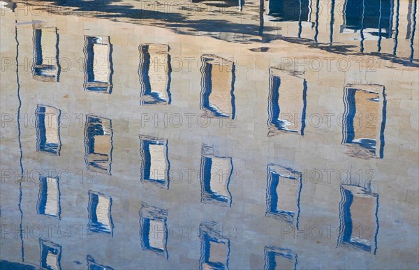 Reflection of the Baroque Basilica del Pilar in the Hispanidad Fountain