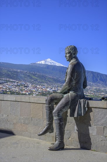 Statue of Humboldt behind the snow-capped Teide