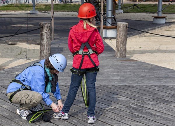 A woman and her niece prepare for their outdoor climbing trip