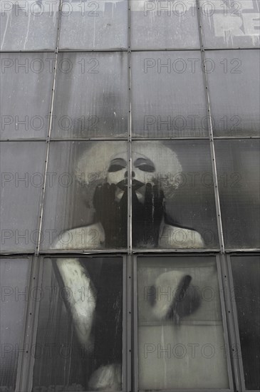 Industrial window with Marilyn Monroe behind the panes